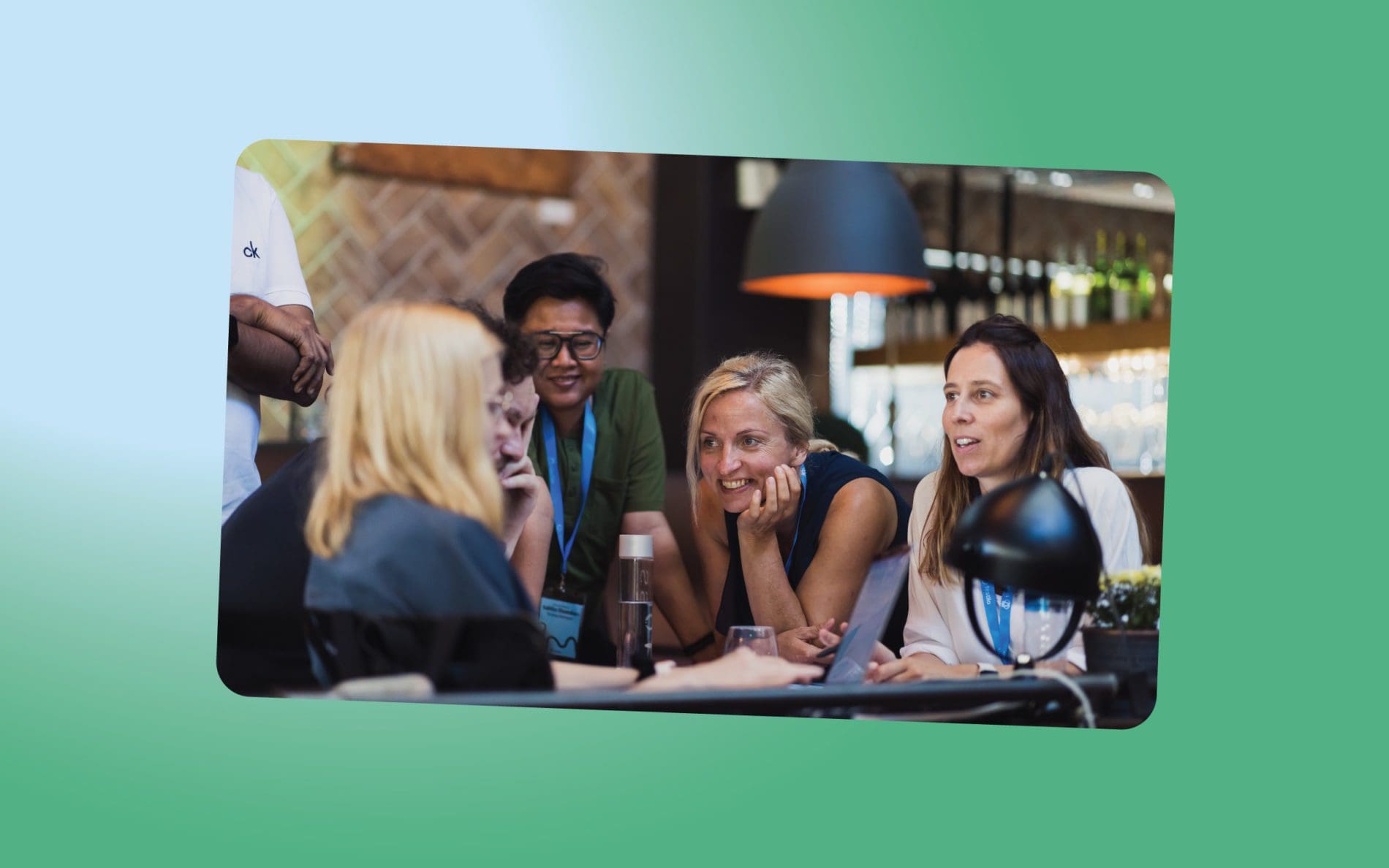 People are gathered around the table, discussing something