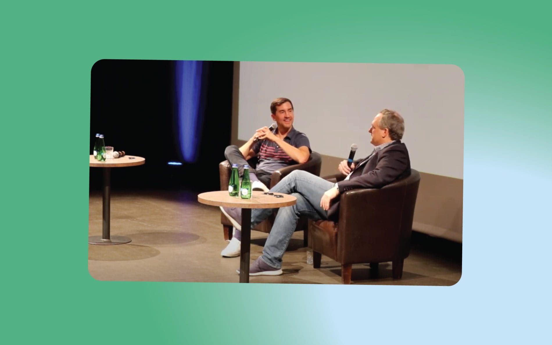 Testlio's CEO Steve and our investor Jeff in armchairs on the stage, talking